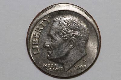 2005 Roosevelt dime off-center strike error showing design shifted away from center