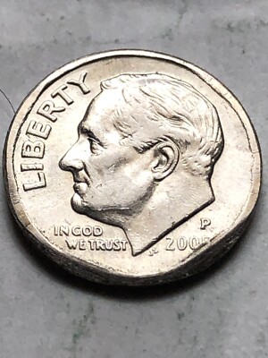 2005 Roosevelt dime broad strike error showing coin wider than normal with missing reeded edge