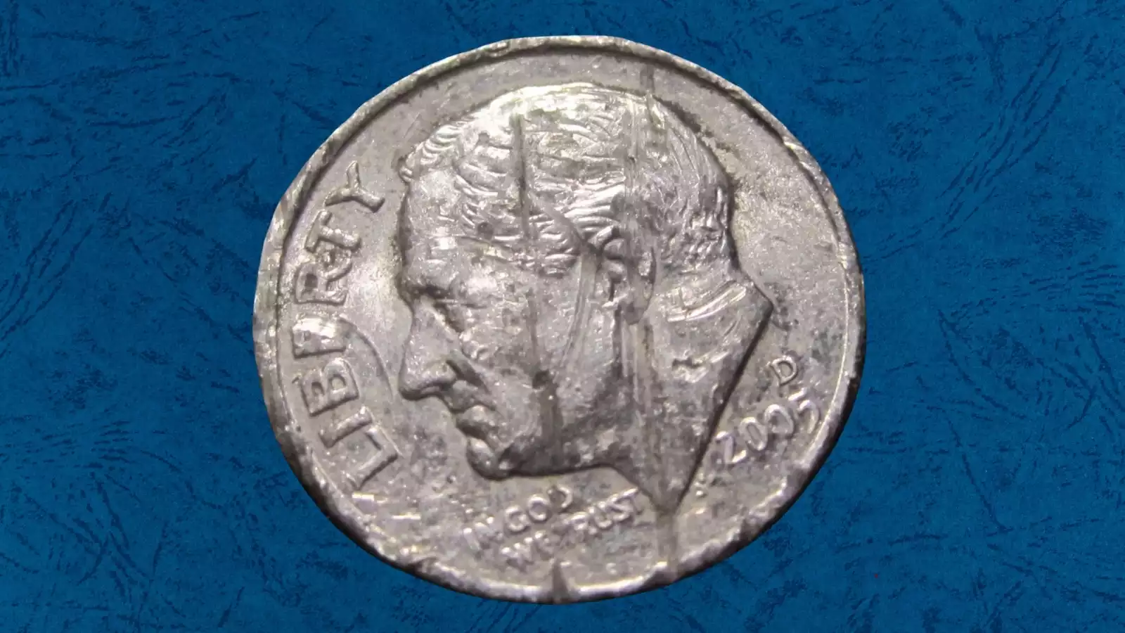 2005 Roosevelt dime die crack and cud error showing raised irregular lines from cracked die